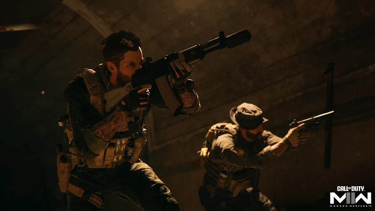 Soap (left) and Price (right), two main characters in the Call of Duty: Modern Warfare franchise, wearing tactical military equipment and moving underground in a tunnel holding weapons.